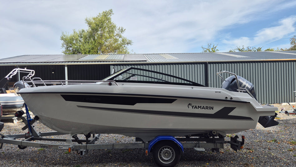 Yamarin 60 DC power boat with sleek design, featuring comfortable seating and modern controls, ready for water adventures.
