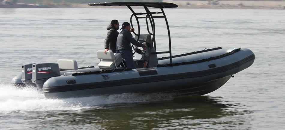 Outdoor Hub Limited Tiger Marine Divemaster 650 rib boat in blue with seating and outboard motor, ready for water adventures.