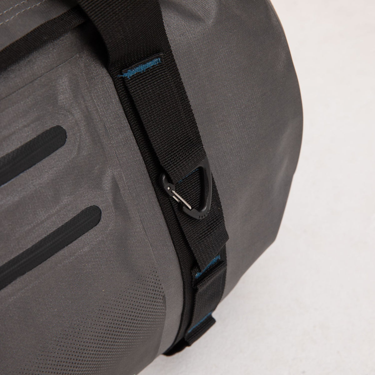 Grey Jobe water-repellent duffle bag by Outdoor Hub Limited, showing its durable fabric and spacious main compartment.