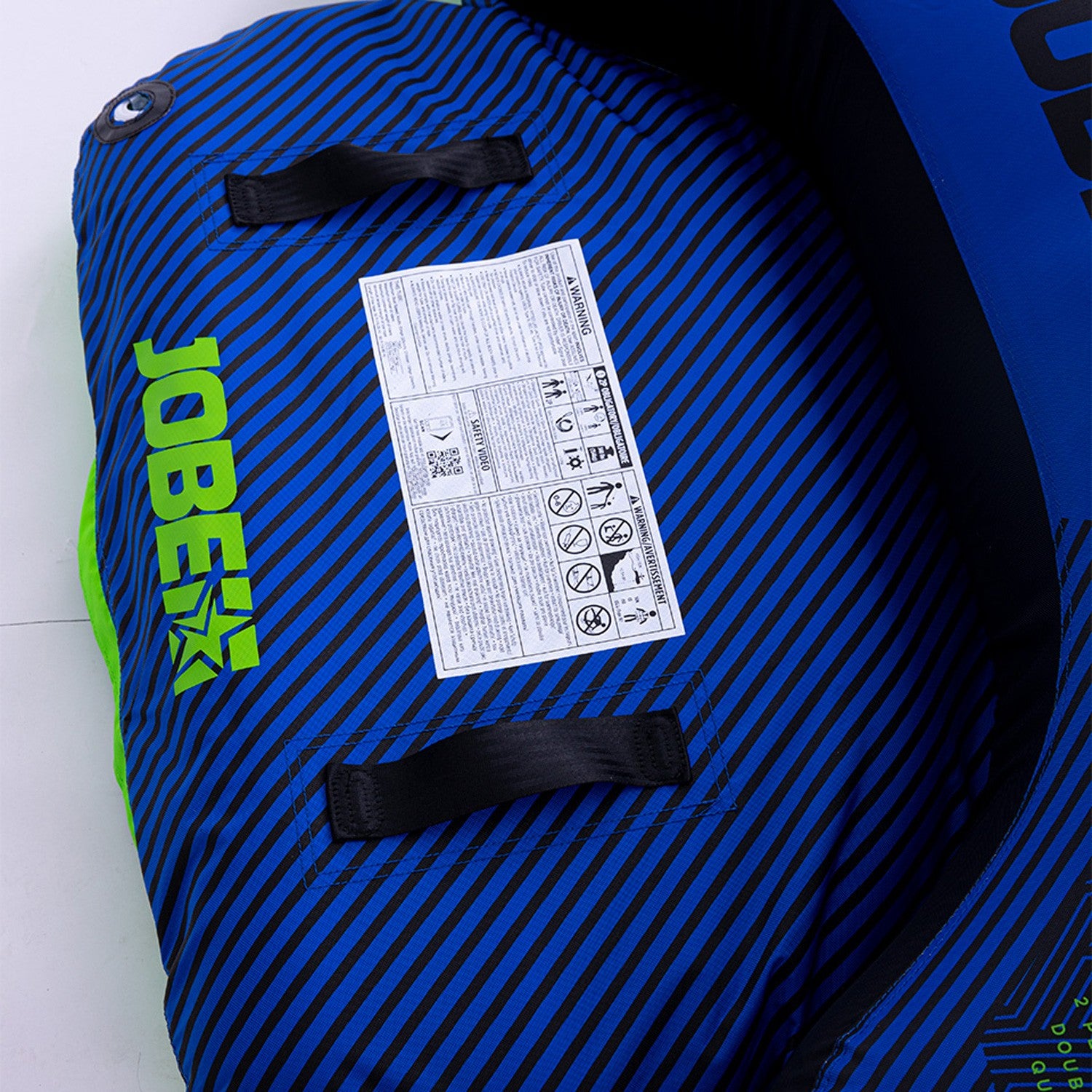 Two-person Jobe Ridge towable boat on water, outdoor water sports gear by Outdoor Hub Limited, with bright blue design.