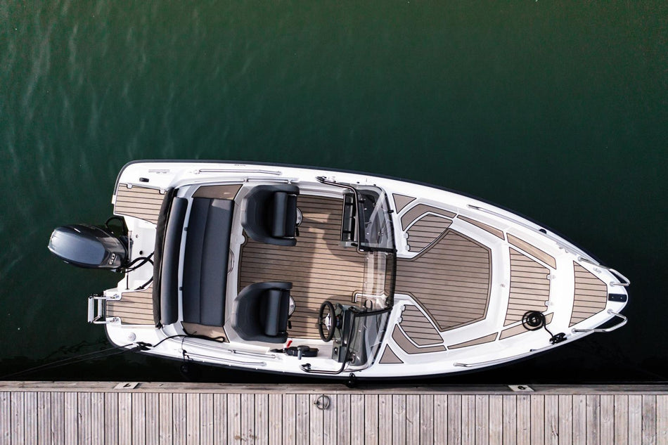 Yamarin 50 BR power boat with bow rider seating, sleek design, and modern features on the water.