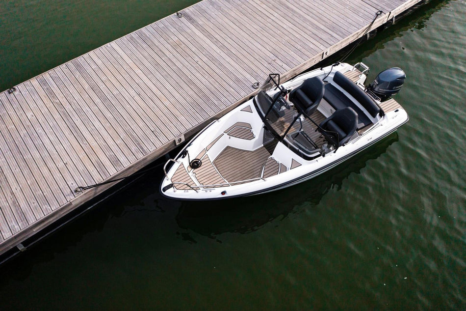 Yamarin 50 BR power boat displaying the bow rider and sleek exterior in a scenic water setting