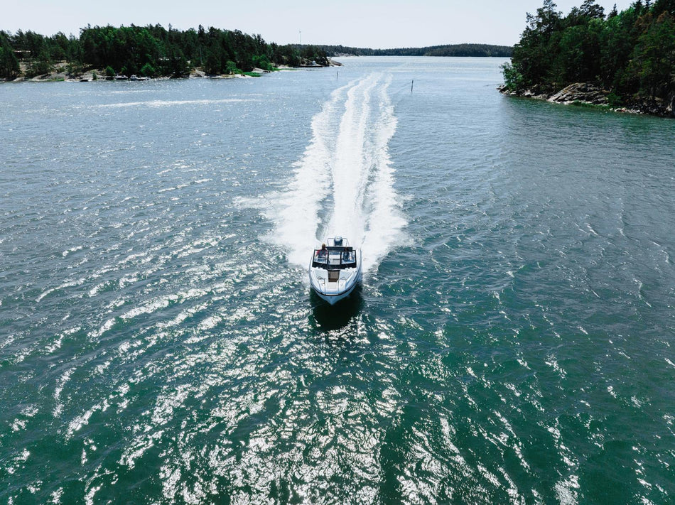 Yamarin 59 BR power boat featuring sleek design and comfortable seating, ideal for leisure boating on calm waters.